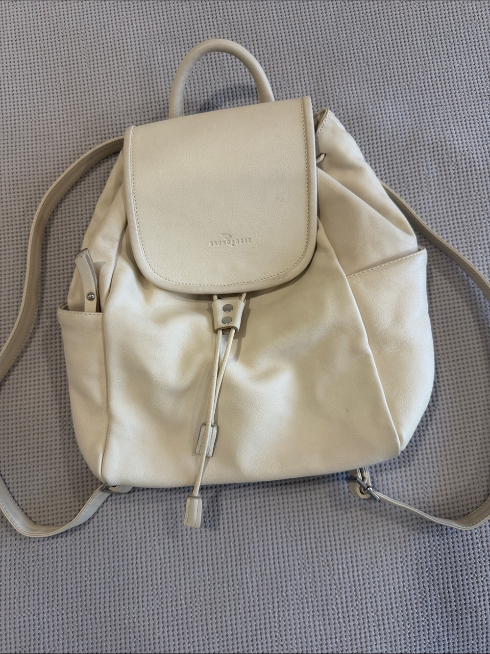 Cream Leather Drawstring Backpack with Flap by Strathberry